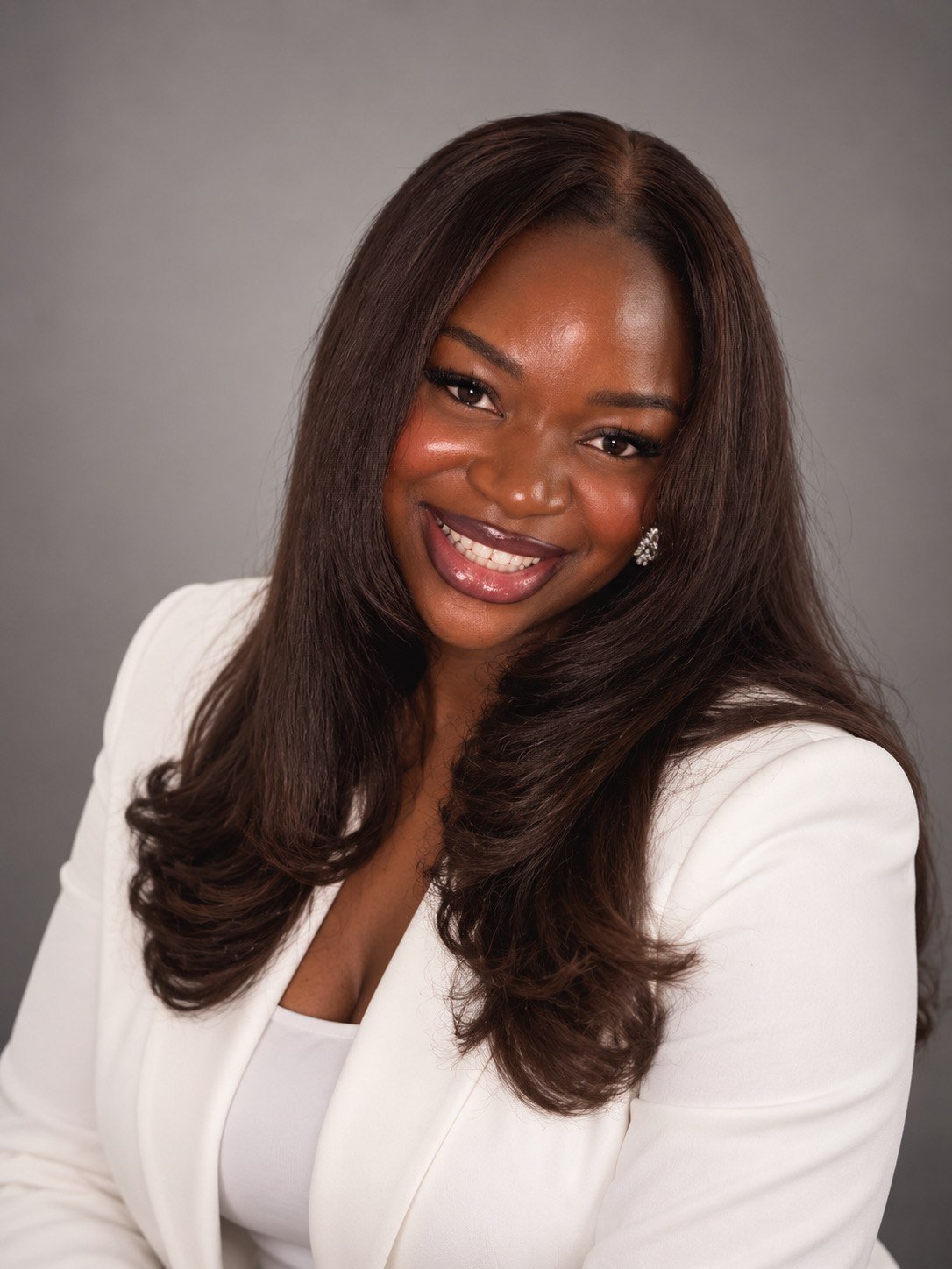 Angel Onons in a white blazer